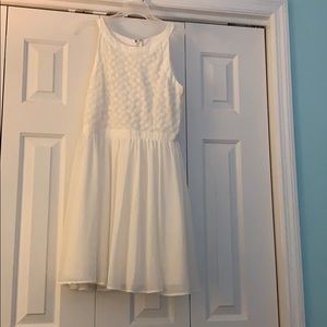 White dress with flowers at top